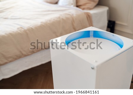 Air recirculator. Protection against viruses with an ultraviolet lamp. Royalty-Free Stock Photo #1966841161