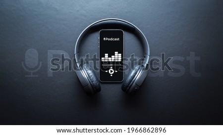 Podcast music. Mobile smartphone screen with podcast application, sound headphones. Audio voice with radio microphone on black background. Broadcast media music banner with copy space