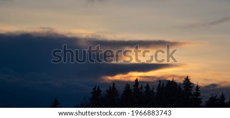 Beautiful clouds in the sky at sunset in the mountains