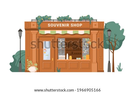 Souvenir shop facade exterior isolated small retail business building flat cartoon. Vector antique store, collectables in shop window, presents, gifts, decorative vases. Green trees, street lamps Royalty-Free Stock Photo #1966905166