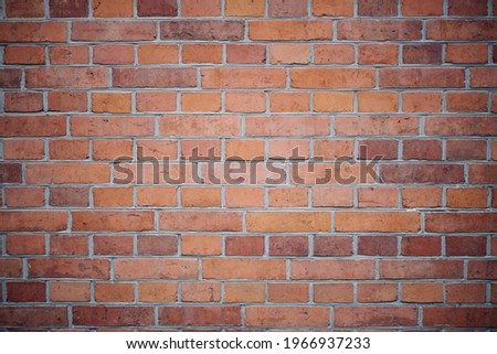 Brick brown wall of a Catholic church.