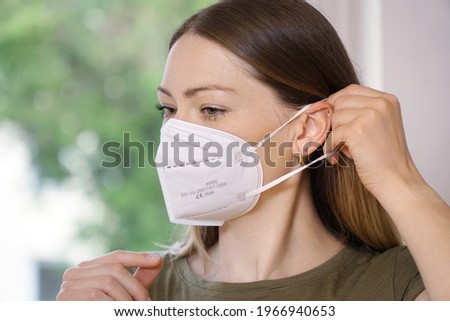  Woman with a fpp2 mask against infection and viruses such as flu, corona virus, covid-19, sars or swine influenca                               Royalty-Free Stock Photo #1966940653