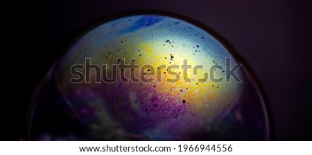 soap bubbles, multicolored patterns, space-like images.