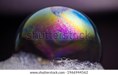 soap bubbles, multicolored patterns, space-like images.