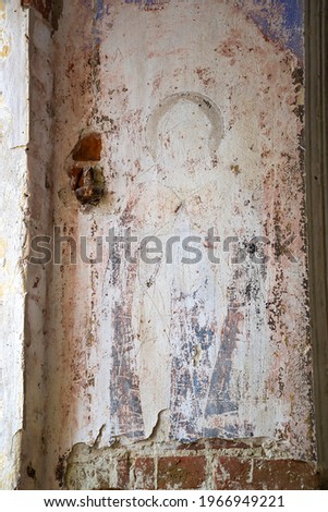 remains of drawings on the walls of a destroyed Orthodox church, Troitskoye village, Kostroma region, Russia