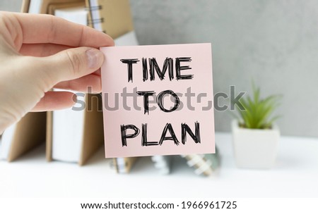 The time to plan is recorded on a piece of paper that lies among the calculator's eyeglasses and watch. Concept photo