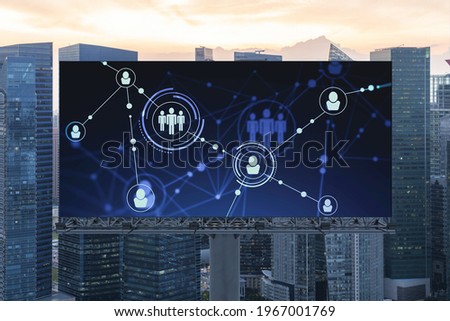 Glowing Social media icons on billboard over sunset panoramic city view of Singapore. The concept of networking and establishing new connections between people and businesses in Southeast Asia