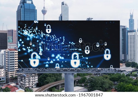 Padlock icon hologram on road billboard over panorama city view of Kuala Lumpur at day time to protect business, Malaysia, Asia. The concept of information security shields.