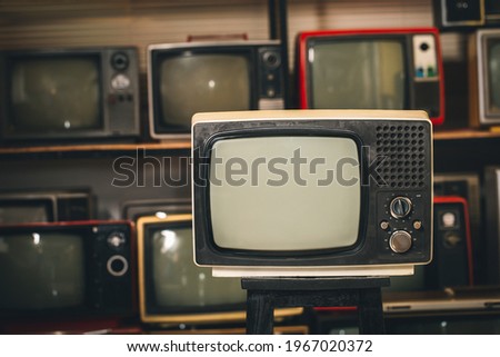 Old vintage television with blank screen in the room, many old tv backgrounds
