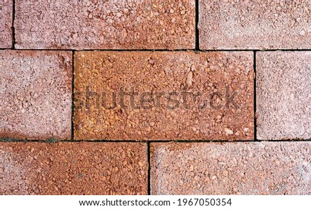 Outdoor brown block stone floor pattern and background seamless, floor tiles background top view