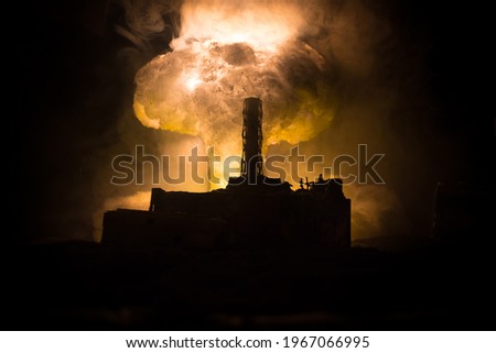 Creative artwork decoration. Chernobyl nuclear power plant at night. Layout of abandoned Chernobyl station after nuclear reactor explosion. Selective focus Royalty-Free Stock Photo #1967066995