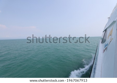 Ship wake on the ocean.aves from the back of a speed boat over the water's surface in sea. Waves behind a boat on a clear blue sea Royalty-Free Stock Photo #1967067913