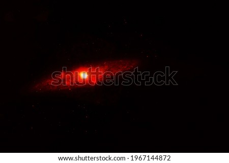 Small galaxy on a dark background. Elements of this image were furnished by NASA. High quality photo