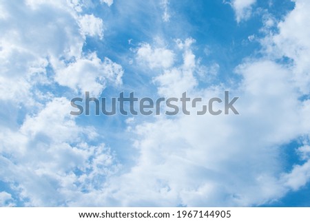 Blue sky and white clouds. Clouds texture. Nice sunny sky. A positive picture