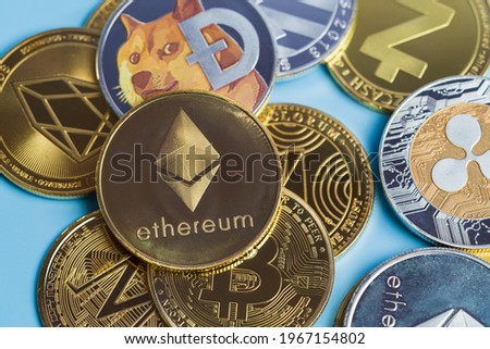 Golden Ethereum ETH group included with Crypto currency coin Dogecoin DOGE, bitcoin BTC, Binance Coin, Zcash TRON symbol Virtual blockchain technology future is money close up and Macro concept. Royalty-Free Stock Photo #1967154802