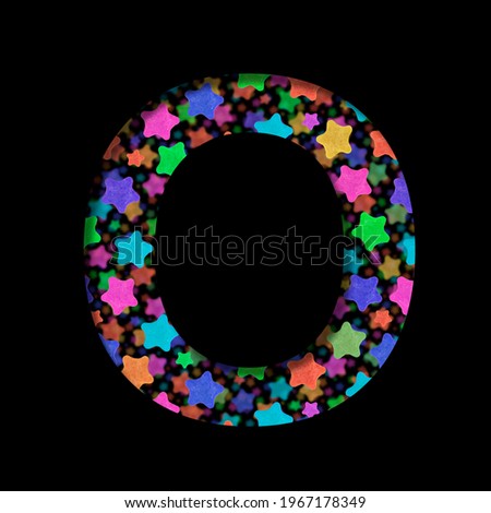 New Years font. The letter O cut out of black paper on the background of bright colored stars of different sizes. Set of New Year or others holidays fonts