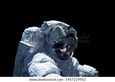 Astronaut in a spacesuit isolated on a black background. Elements of this image were furnished by NASA. High quality photo