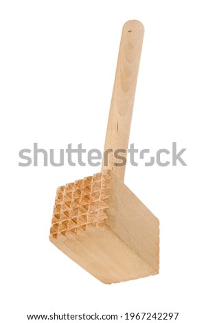 Wooden meat grinder on a chopping board. Wooden kitchen utensils on the kitchen table. Isolated background.