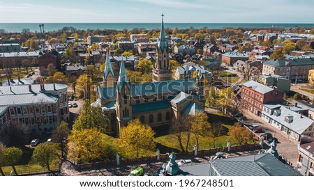 Liepaja, Latvia,Baltics. Beautiful panoramic aerial view photo from flying drone to Liepaja city St. Joseph's Cathedral  which is located by the Baltic Sea. (Series)  Royalty-Free Stock Photo #1967248501