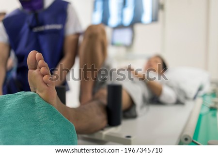 Selective focus with blurred.Doctor using stress test in ankle instability patient with chronic ankle sprain.The force was apply before radiographic study. Royalty-Free Stock Photo #1967345710
