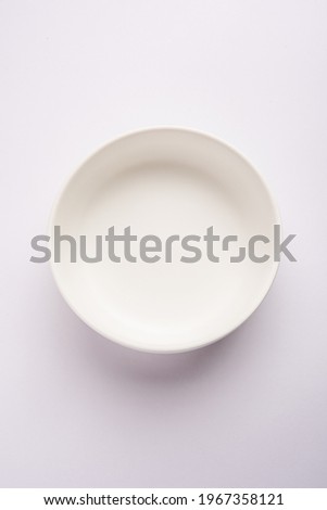 Empty white ceramic serving bowl, isolated over white or gray background Royalty-Free Stock Photo #1967358121