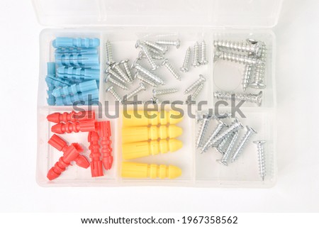 Screw set in plastic box isolated on a white background