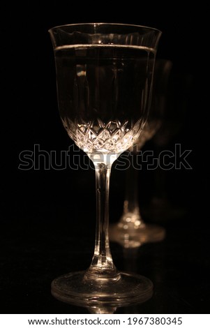 Glass liquid with black background
