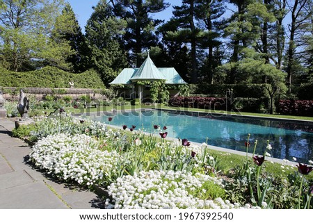 The swimming pool at the Chanticleer Garden in Spring, Wayne, suburb of Philadelphia, Pennsylvania, USA Royalty-Free Stock Photo #1967392540