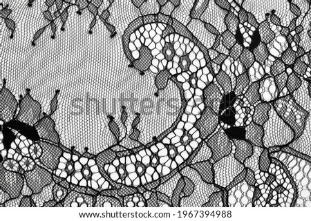 Black lace fabric. Vintage floral background. dark black vintage old floral lace