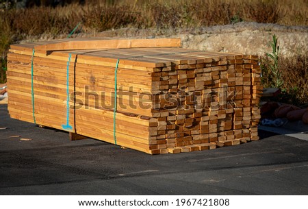 Lumber stacked at a housing construction site 