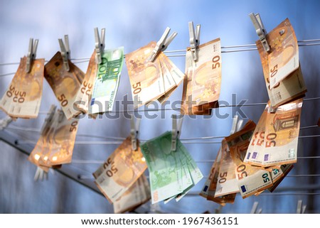 100 and 50 euro banknotes drying. Washed Euro paper bills. Drying euro on a string.Money laundering Royalty-Free Stock Photo #1967436151