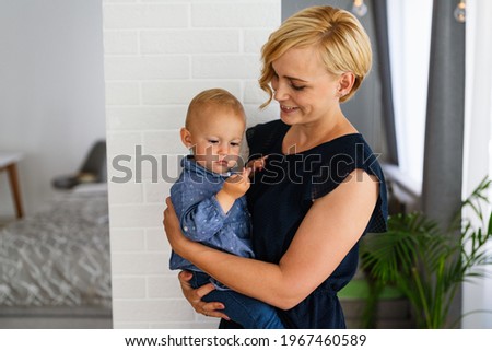 Happy loving family. Mother and child girl playing, kissing and hugging