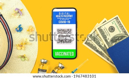 Smartphone displaying a valid digital vaccination certificate passport for COVID-19 coronavirus, concept photo flat lay background for summer vacation