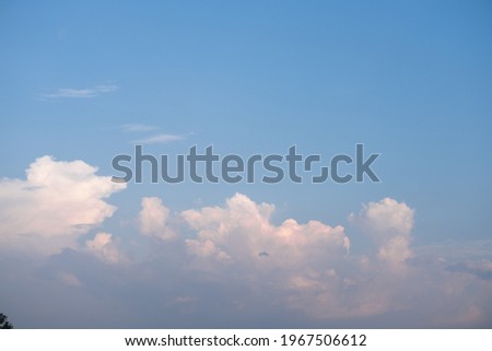 White clouds against blue sky in horizontal background and copy space 