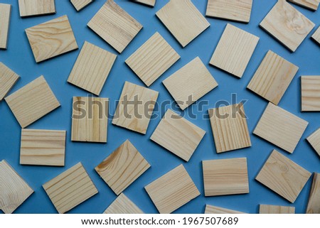 Wooden blocks or cubes on blue background