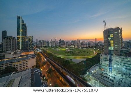 Aerial view of Bangkok Sports Club, golf field in Ratchadamri district, Bangkok Downtown Skyline. Thailand. Financial district in smart urban city in Asia. Skyscraper and high-rise buildings