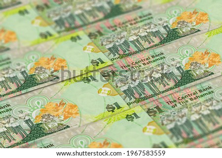 Bahamian dollars banknotes background. BSD dollars pattern. 1 BSD
