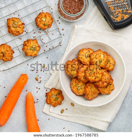Freshly baked homemade carrot cookies with flax seed and pumpkin seeds. Delicious and healthy vegetarian snack. Selective Focus, square picture
