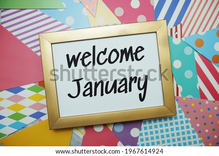 Welcome January text on colorful background