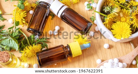 Celandine dandelion extract in a littel bottle, treatment, medicine, tincture. selective focus.nature