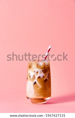 Iced Coffee with Milk in Tall Glasses on Pink Background. Concept Refreshing Summer Drink Royalty-Free Stock Photo #1967627131