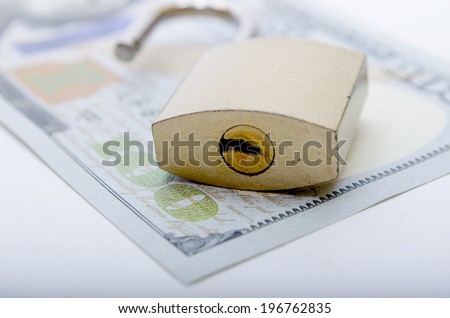 Dollar with padlock as a concept of protection