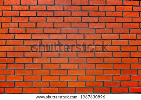 view of the wall built with red bricks