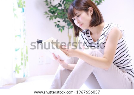 Image of a woman reading a book 
