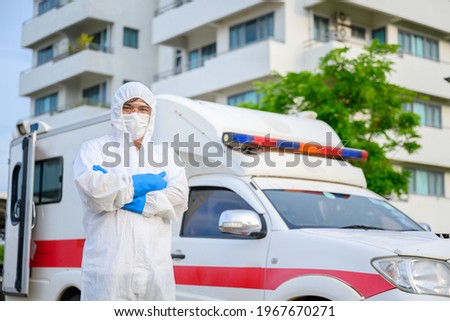 Health workers in emergency ambulances wear PPE clothing and face masks. Hospital Exit, Outpatient Quarantine Tent, Intensive Care Center in COVID-19 Hospital Royalty-Free Stock Photo #1967670271