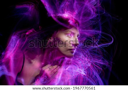 Portrait in the style of light painting. Long exposure photo, abstract portrait ,sound waves