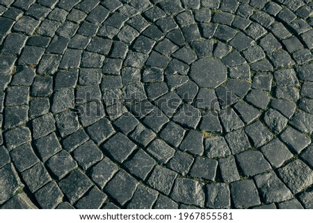 View of cobblestone street. The texture of the city pavement. 