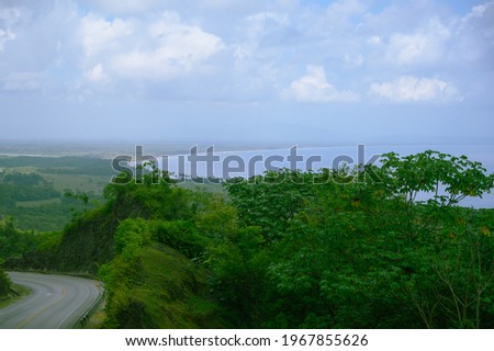The photo was taken from a high point in the mountains of the Dominican Republic to the ocean. The prospect turned out to be great, very beautiful and charming.
