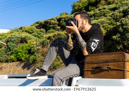 Photographer taking photos in nature and on the beach