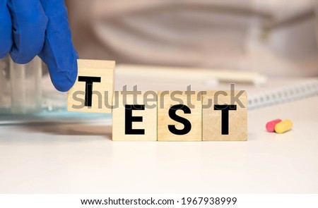 Test word construction with letter blocks cubes and a shallow depth of field.